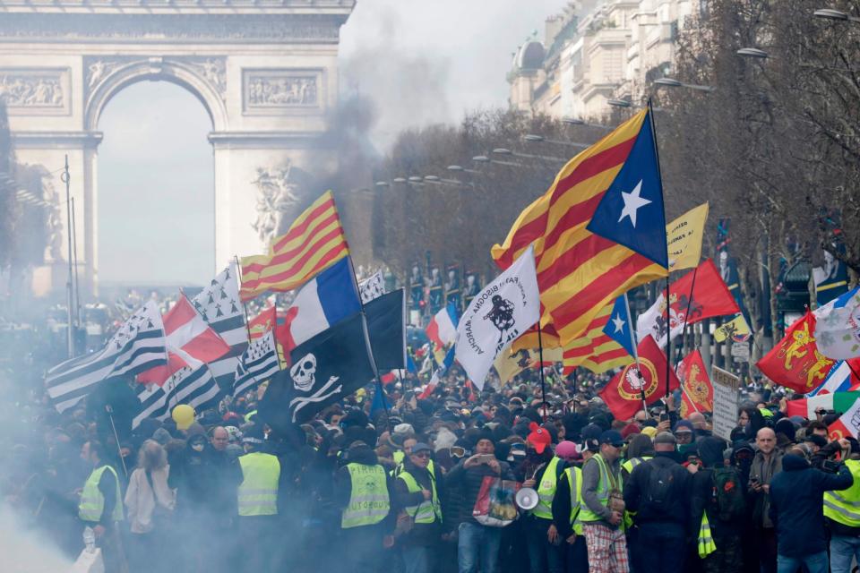 Yellow vest protesters on the Champs-Elysees in Paris on March 16 (AFP/Getty Images)