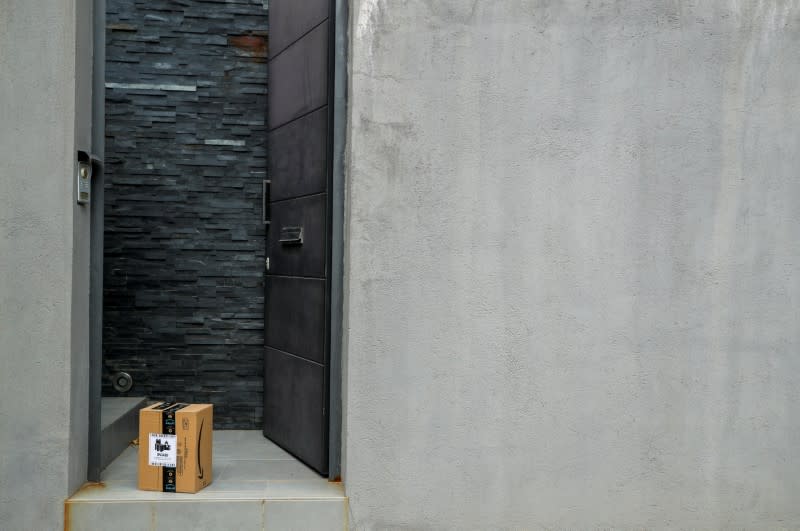 An Amazon package is delivered and left at the door during the coronavirus disease (COVID-19) outbreak in El Masnou