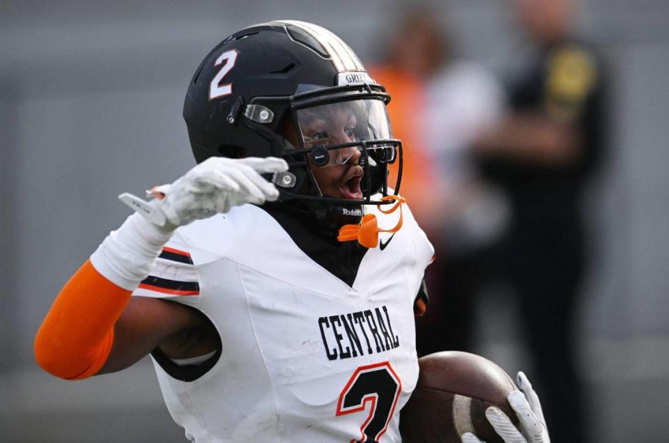 Central High’s Brandon Smith carries the ball against Garza High in the opening game of the 2024 season at Koligian Stadium Friday, Aug. 23, 2024 in Fresno.