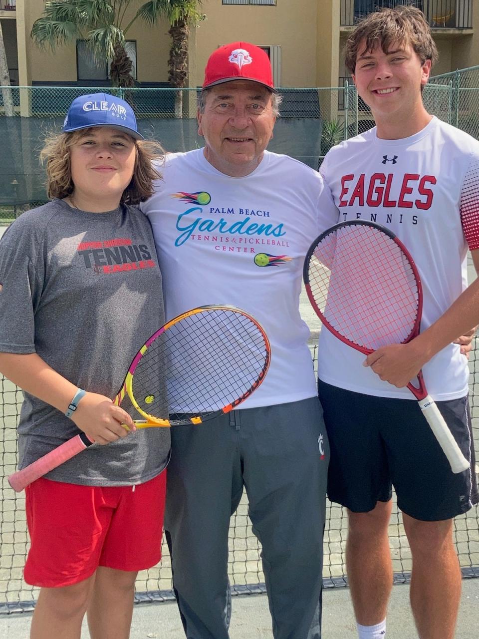 MLB legend Johnny Bench (center) supports his sons Justin and Josh, who play tennis for Jupiter Christian in 2024.