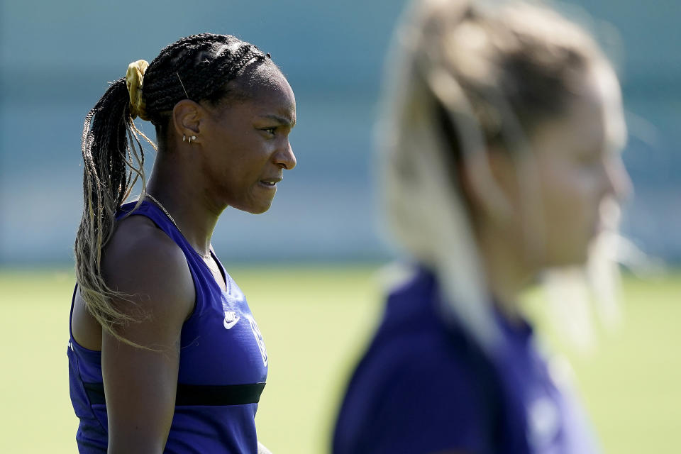 U.S. national team player Crystal Dunn listens to instructions with teammates during practice for a match against Nigeria Tuesday, Aug. 30, 2022, in Riverside, Mo. Women’s soccer in the United States has struggled with diversity, starting with a pay-to-play model that can exclude talented kids from communities of color. (AP Photo/Charlie Riedel)