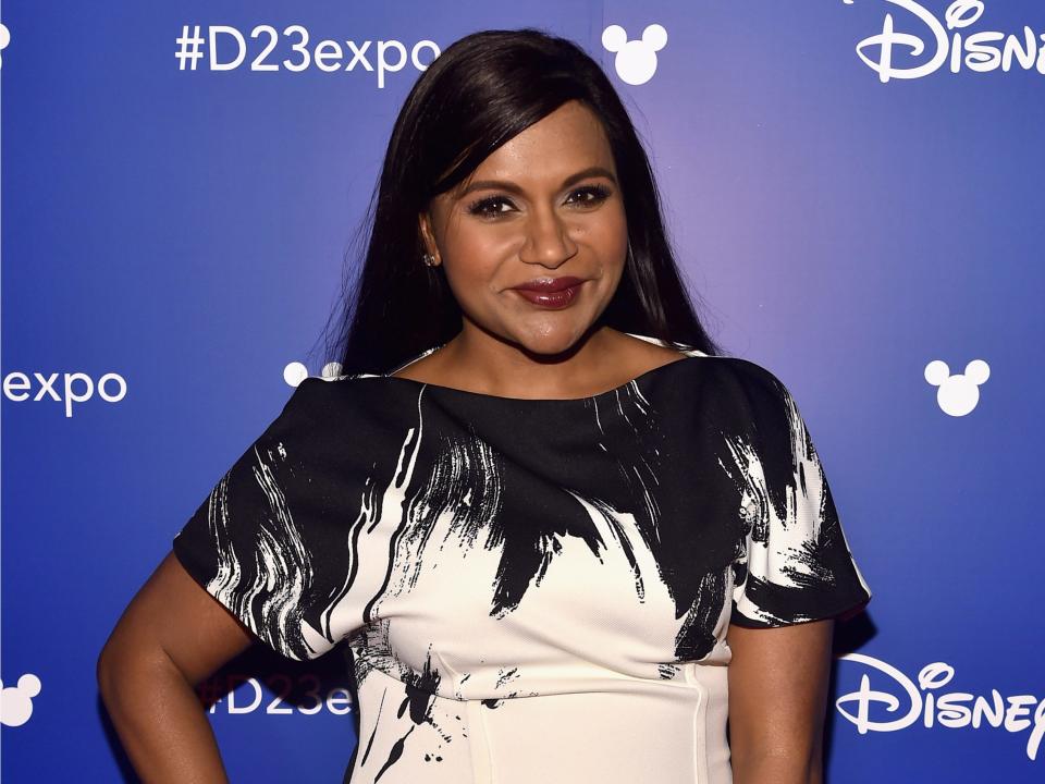 Mindy Kaling wears a black and white dress