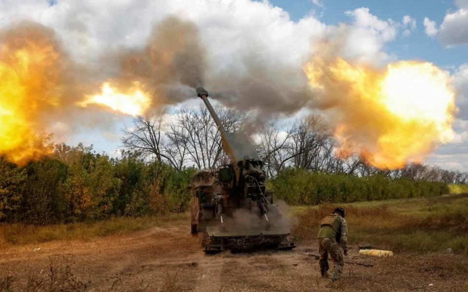 A Ukrainian serviceman fires a 2S22 Bohdana self-propelled howitzer towards Russian troops in Donetsk