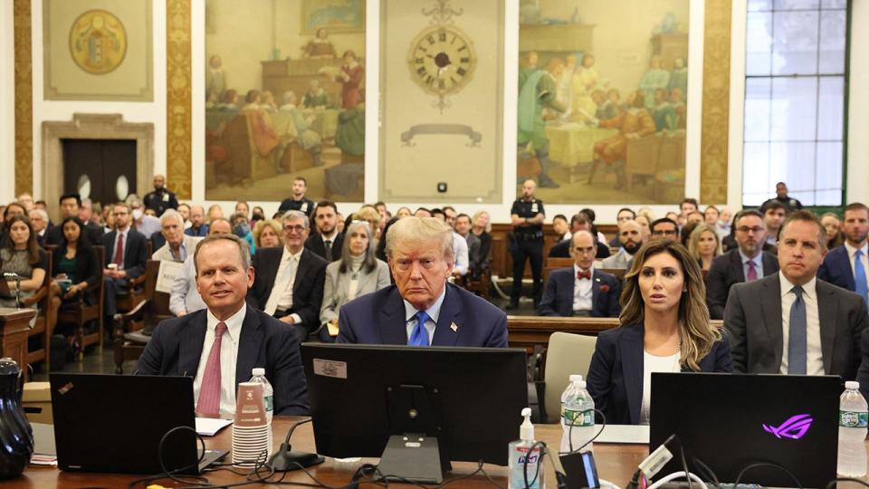 Former US President Donald Trump (C) sits with his attorneys inside the courtroom during his civil fraud case brought by state Attorney General Letitia James, at a Manhattan courthouse, in New York City, on October 2, 2023. Former US president Donald Trump was in court Monday for what he slammed as a 