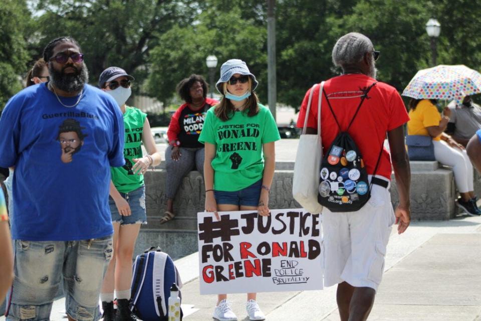 Marleigh Baudoin of Lafayette holds a sign during a rally to support Ronald Greene’s family at the Louisiana State Capitol on Thursday, May 27, 2021.