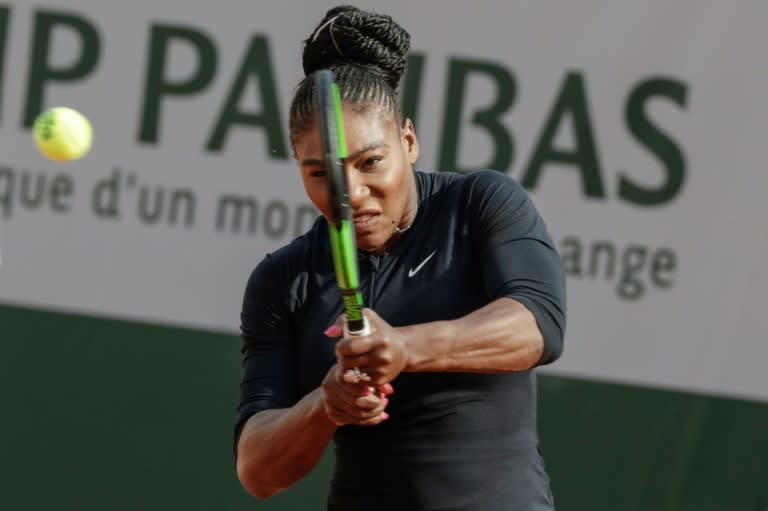 Serena Williams returns a shot during a training session at the Roland Garros stadium in Paris, ahead of the French Open tennis tournament