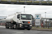 A fuel tanker leaves the Valero Manchester Terminal, in Manchester, England, Tuesday, Sept. 28, 2021. Thousands of British gas stations have run dry, as motorists scrambled to fill up amid a supply disruption due to a shortage of truck drivers. Long lines of vehicles formed at many gas stations over the weekend, and tempers frayed as some drivers waited for hours. (AP Photo/Jon Super)