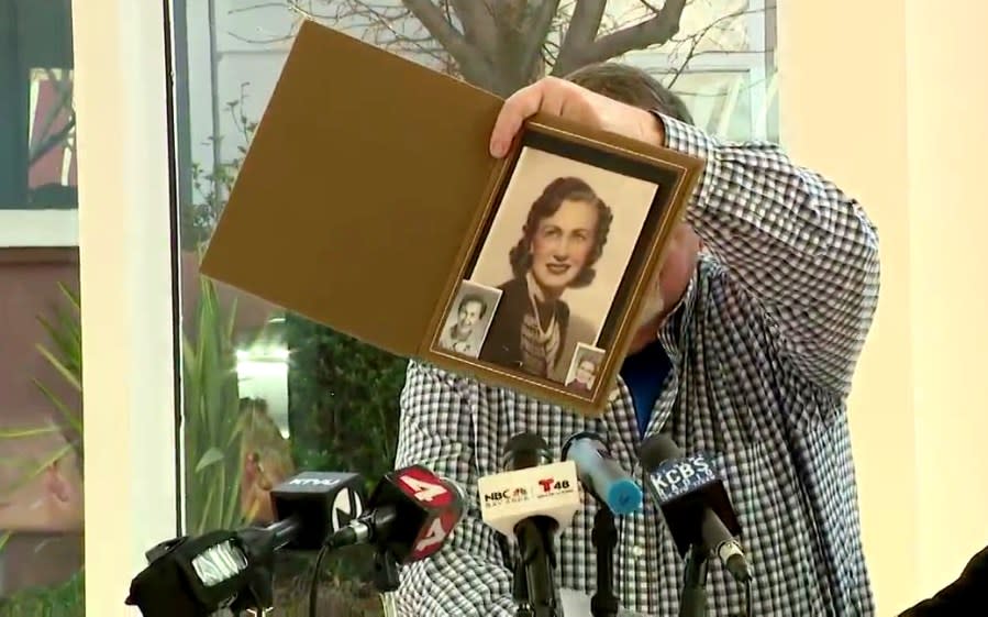 Dave Hicks hold up a photograph of his mother, Nellie Hicks, at a press conference on Feb. 8, 2024. (KRON4 Photo)