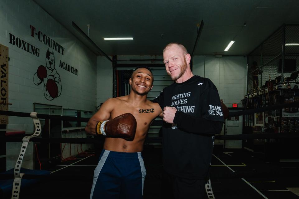 Andre Donovan, left, has been a professional boxer for a year, and currently trains under Lee Kreisher, right, at T-County Boxing Academy, in New Philadelphia.