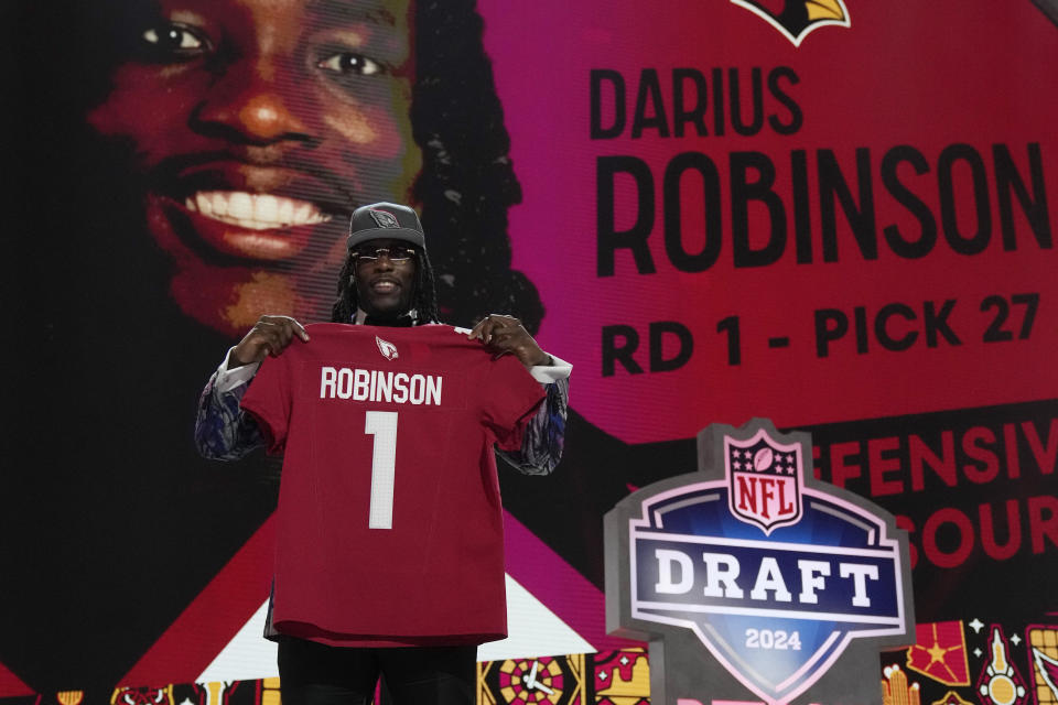 Missouri defensive lineman Darius Robinson poses after being chosen by the Arizona Cardinals with the 27th overall pick during the first round of the NFL football draft, Thursday, April 25, 2024, in Detroit. (AP Photo/Jeff Roberson)