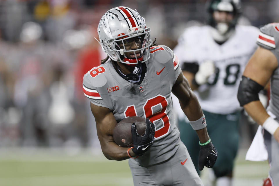 FILE -Ohio State receiver Marvin Harrison Jr. plays against Michigan State during an NCAA college football game Saturday, Nov. 11, 2023, in Columbus, Ohio. Two-time AP All-America receiver Marvin Harrison Jr. is with Ohio State as the seventh-ranked Buckeyes prepare for the Cotton Bowl, though there are no indications that he will play Friday night, Dec. 29, 2023 against Missouri.(AP Photo/Jay LaPrete, File)