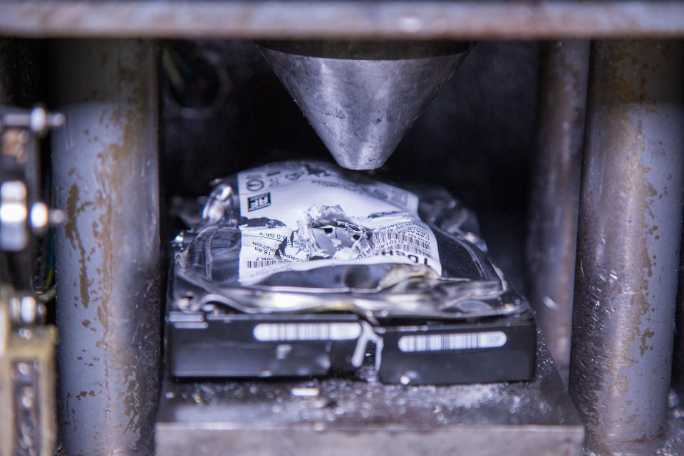 A hard drive with a hole punched through it by one of the Shred-it machines. (PHOTO: Dhany Osman / Yahoo News Singapore)