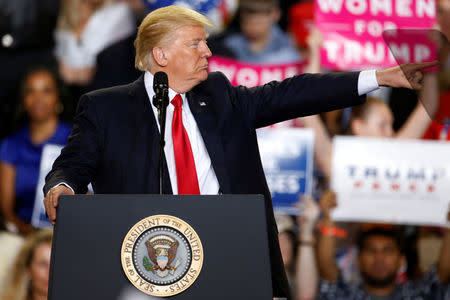 FILE PHOTO: U.S. President Donald Trump appears on stage at a rally in Harrisburg, Pennsylvania, U.S. April 29, 2017. REUTERS/Carlo Allegri/File Photo