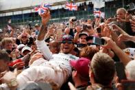 Britain Formula One - F1 - British Grand Prix 2016 - Silverstone, England - 10/7/16 Mercedes' Lewis Hamilton celebrates with fans after winning the race REUTERS/Andrew Boyers Livepic