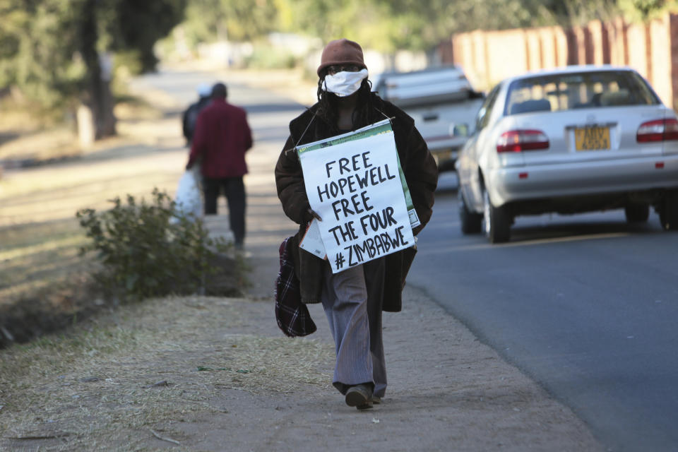 Internationally acclaimed author and filmmaker Tsitsi Dangarembwa demonstrates for the release of Zimbabwe Journalist Hopewell Chin'ono in Harare, on Monday July 22, 2020. Dangarembwa spent a night in jail for standing by a Harare road and holding a placard that said "We want Better. Reform Our Institutions." Human rights defenders say it appears the government is using restrictions imposed to combat COVID-19 to suppress political criticism. Opposition officials, human rights groups and some analysts accuse Mnangagwa of abusing the rights of critics, using tactics as harsh as his predecessor, the late Robert Mugabe. (AP Photo/Tsvangirayi Mukwazhi)