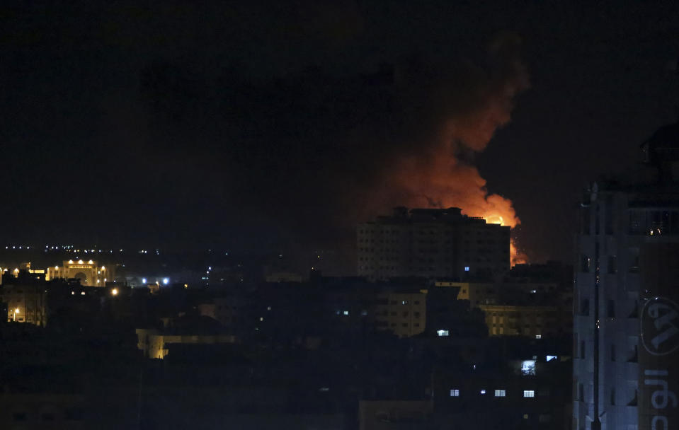 An explosion caused by Israeli airstrikes on Gaza City, early Saturday, Oct. 27, 2018. Israeli aircraft struck several militant sites across the Gaza Strip early Saturday shortly after militants fired rockets into southern Israel, the Israeli military said. (AP Photo/Adel Hana)