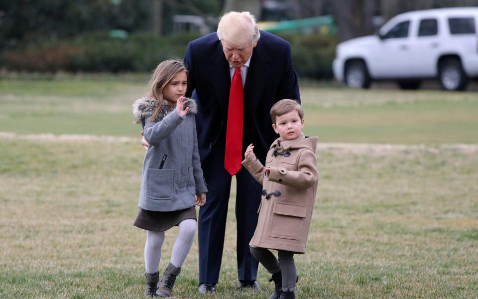 Donald Trump escorts grandchildren on to Marine One presidential helicopter