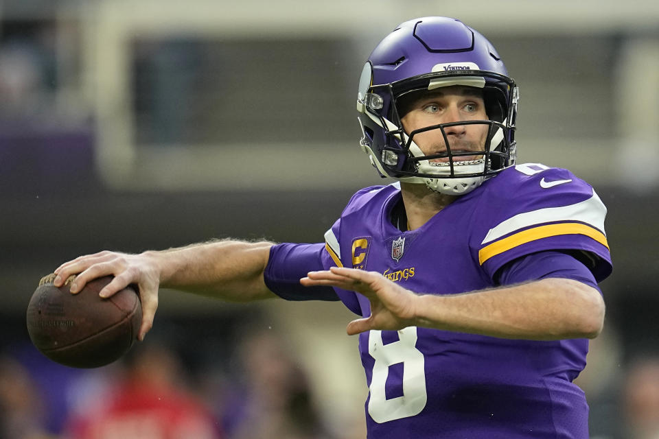 FILE -Minnesota Vikings quarterback Kirk Cousins (8) looks to pass during the first half of an NFL wild-card football game against the New York Giants, Sunday, Jan. 15, 2023, in Minneapolis. The Vikings reached an agreement with quarterback Kirk Cousins on Tuesday, March 14, to change bonus language in his existing contract that cleared $16 million from their salary cap for 2023, according to a person with knowledge of the negotiation.(AP Photo/Abbie Parr, File)