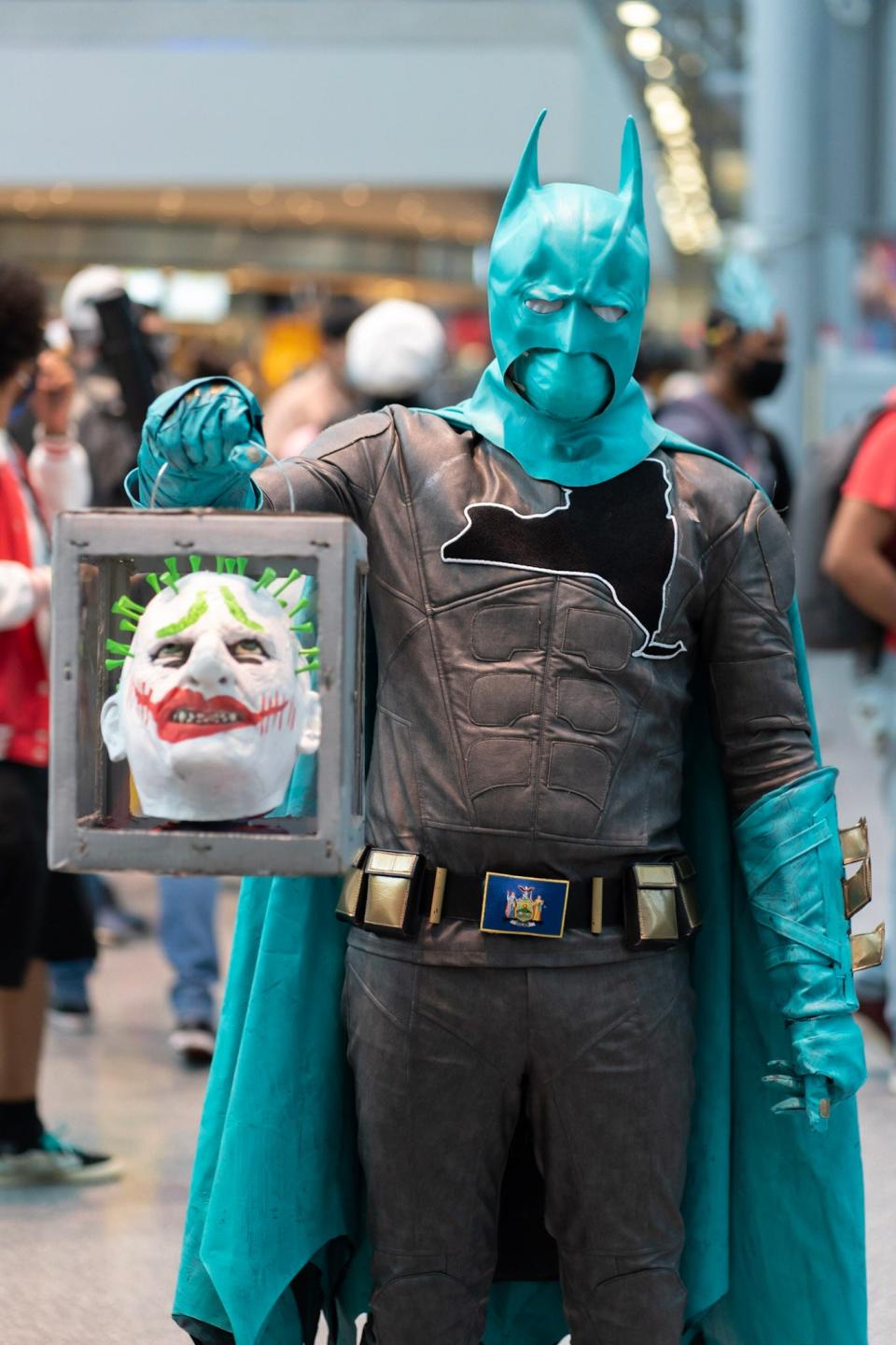 A cosplayer dressed as a New York version of Batman at New York Comic Con 2021.