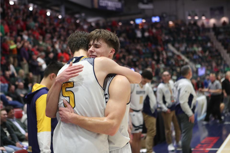 Wayne's Cam Blackenberg (5) and PJ Ostrowski (30) console each other after Wayne was defeated by Glens Falls 50-37 in the state championship game at the Cool Insuring Arena in Glens Falls, New York March 16, 2024.