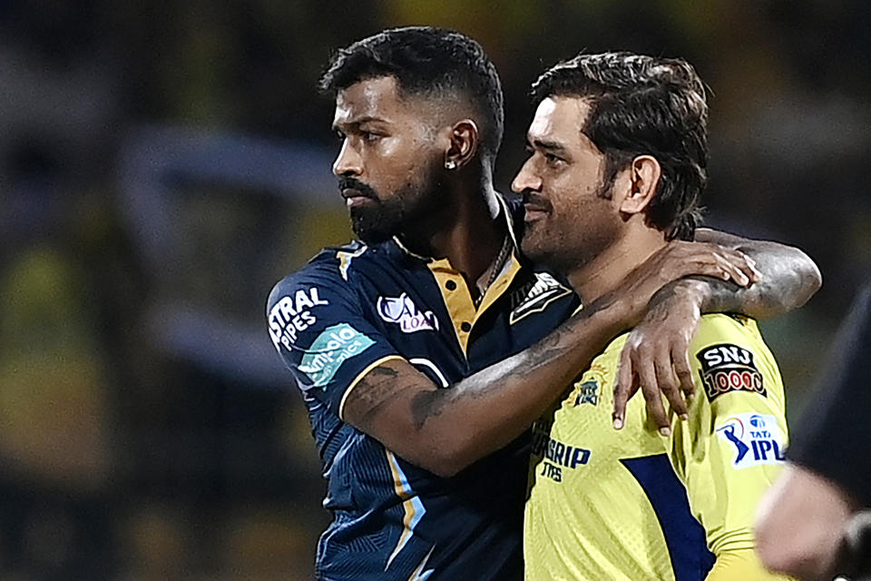 Chennai Super Kings' Mahendra Singh Dhoni (R) and Gujarat Titans' Hardik Pandya gesture during toss before the start of the Indian Premier League (IPL) Twenty20 first qualifier cricket match between Chennai Super Kings and Gujarat Titans at the MA Chidambaram Stadium in Chennai on May 23, 2023. (Photo by R.Satish BABU / AFP) (Photo by R.SATISH BABU/AFP via Getty Images)