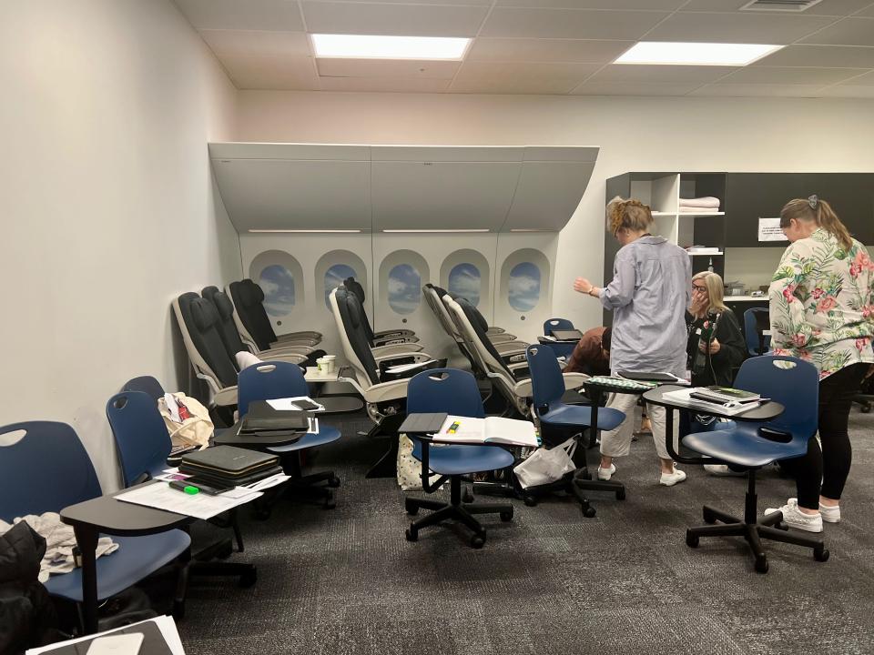 Desks and a small cabin mockup in the classroom — Air New Zealand's Academy of Learning in Auckland.