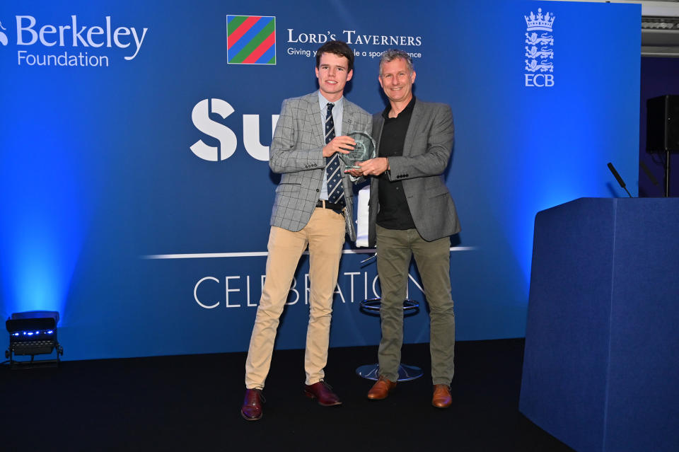 James Grindrod picks up his Super 1s Inspire Award from comedian Adam Hills at Lord's