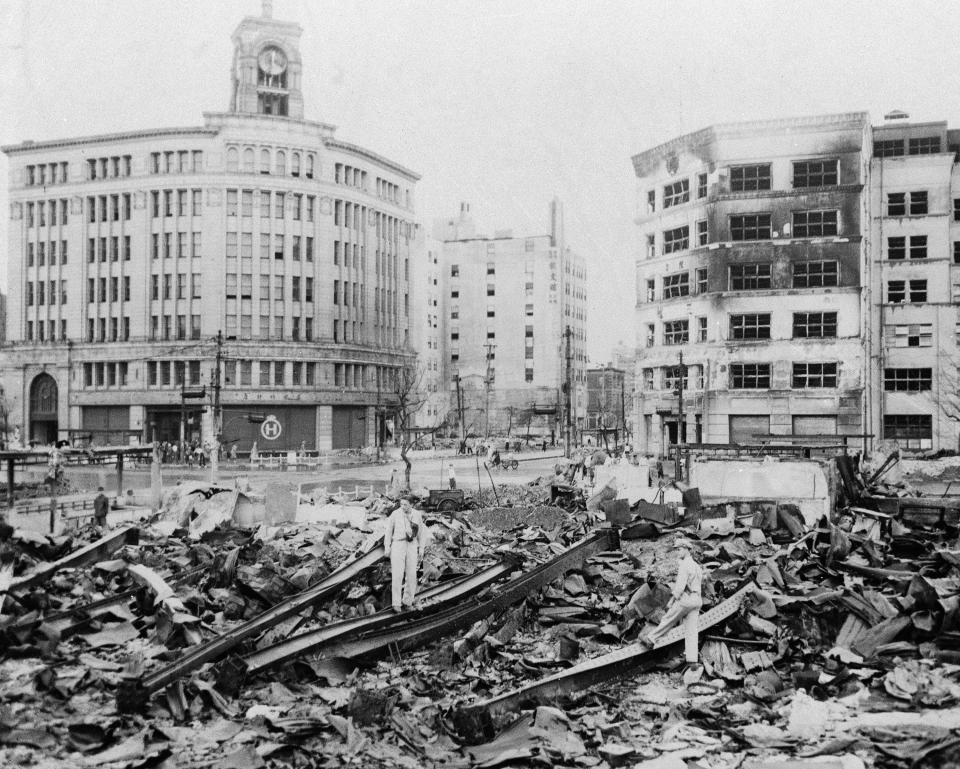 Unidentified U.S. Army men look over the bombed section of Tokyo, Japan's Ginza district, which is comparable to New York's Fifth Avenue, Sept. 3, 1945. Building in center background seems undamaged. In Japan, war orphans were punished for surviving. They were bullied. They were called trash, sometimes rounded up by police and put in cages. Some were sent to institutions or sold for labor. They were targets of abuse and discrimination. Now, 75 years after the war's end, some are revealing their untold stories of recovery and pain, underscoring Japan’s failure to help its own people. (AP Photo)