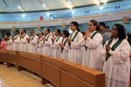 Expat worshippers attend a mass in a religious complex, as Catholics are awaiting a historical visit by Pope Francis to United Arab Emirates, in Doha, Qatar January 27, 2019. REUTERS/Naseem Zeitoon