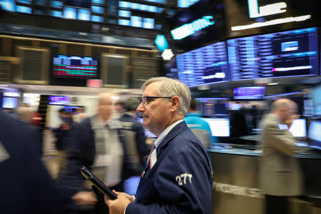 Traders work on the floor of the New York Stock Exchange (NYSE) in New York, U.S., February 8, 2019. REUTERS/Brendan McDermid