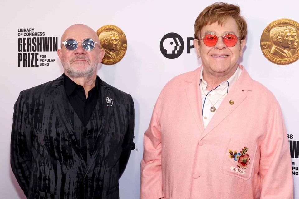 <p>Kevin Mazur/Getty</p> Bernie Taupin and Elton John at the Library Of Congress 2024 Gershwin Prize for Popular Song 