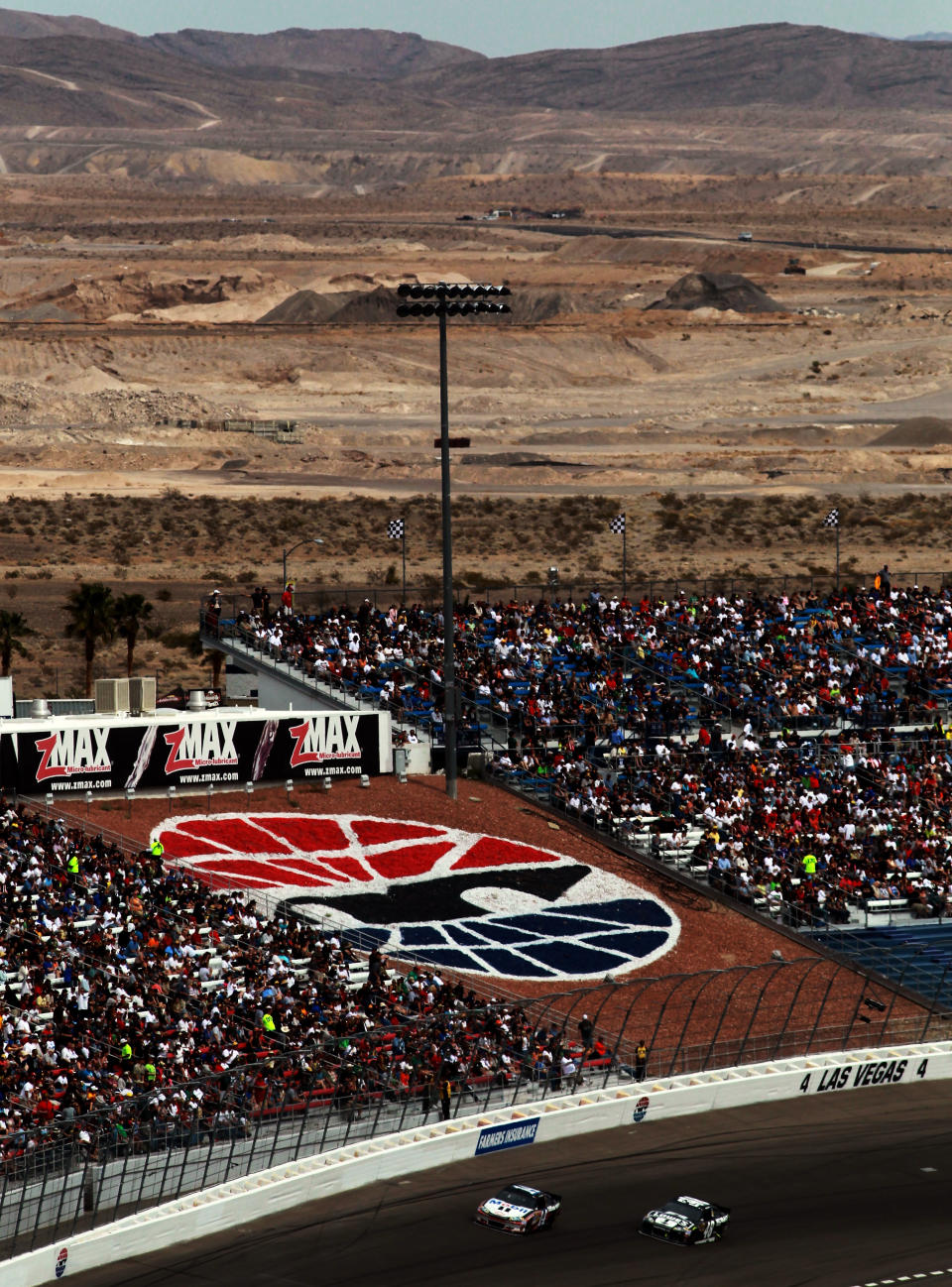 LAS VEGAS, NV - MARCH 11: Tony Stewart, driver of the #14 Mobil 1/Office Depot Chevrolet, leads Jimmie Johnson, driver of the #48 Lowe's/Kobalt Tools Chevrolet, during the NASCAR Sprint Cup Series Kobalt Tools 400 at Las Vegas Motor Speedway on March 11, 2012 in Las Vegas, Nevada. (Photo by Ronald Martinez/Getty Images for NASCAR)