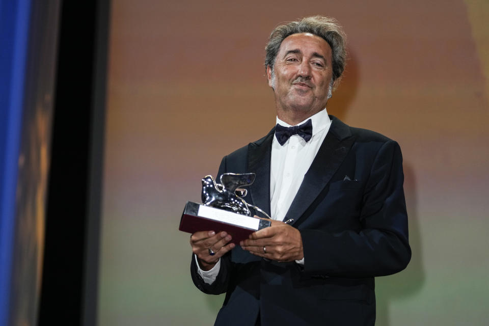 Paolo Sorrentino holds the Silver Lion Grand Jury Prize for 'The Hand Of God' onstage at the closing ceremony during the 78th edition of the Venice Film Festival in Venice, Italy, Saturday, Sept. 11, 2021. (AP Photo/Domenico Stinellis)