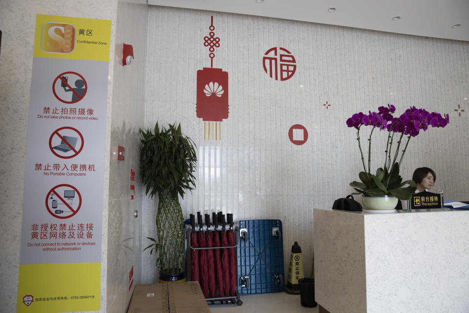 In this Aug. 21, 2019, photo, restriction notices are prominently displayed at the entry to a Huawei lab in Dongguan in Southern China's Guangdong province. Facing a ban on access to U.S. technology, Chinese telecom equipment maker Huawei is showing it increasingly can do without American components and compete with Western industry leaders in pioneering research. (AP Photo/Ng Han Guan)