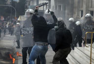 <p>Demonstrators confront riot police during a 24-hour general strike against the latest round of austerity in Athens, Greece, May 17, 2017. (Alkis Konstantinidis/Reuters) </p>