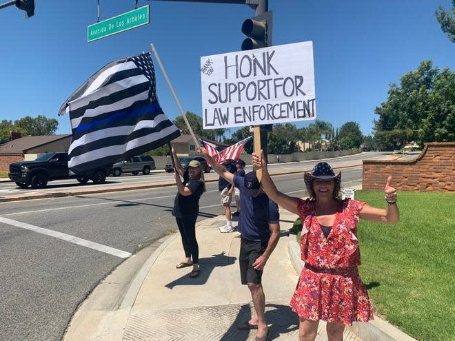 Gina Libby, right, in Thousand Oaks at a rally in support of law enforcement on Aug. 29, 2020.