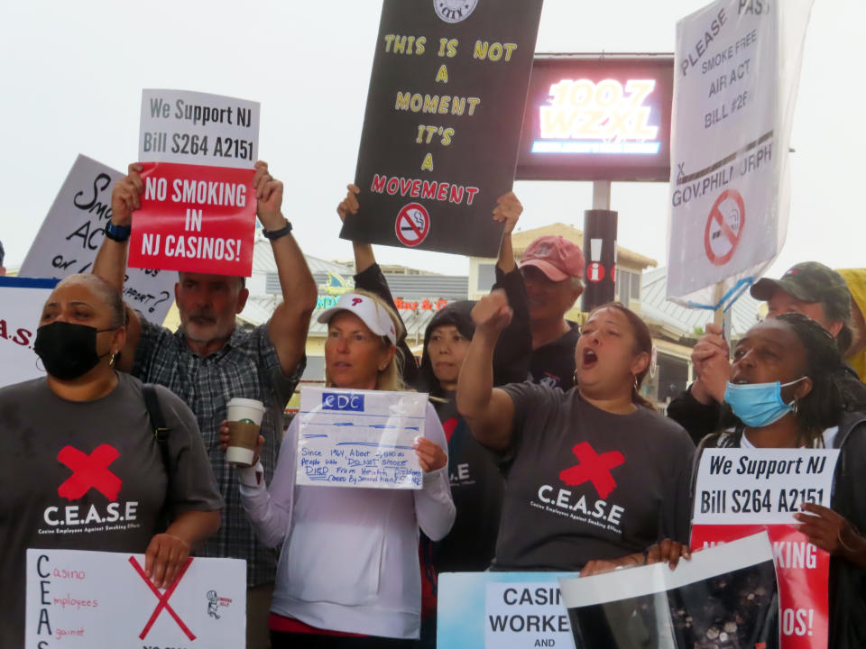 Casino workers and patrons opposed to smoking in the gambling halls demonstrate outside the Hard Rock casino, Thursday, Sept. 22, 2022, in Atlantic City N.J., after New Jersey Gov. Phil Murphy spoke to a major casino industry conference. A bill that would ban smoking in casinos -virtually the only indoor workplace where it is allowed - is stalled in the New Jersey Legislature, even though Murphy has said he will sign it if it passes. (AP Photo/Wayne Parry)