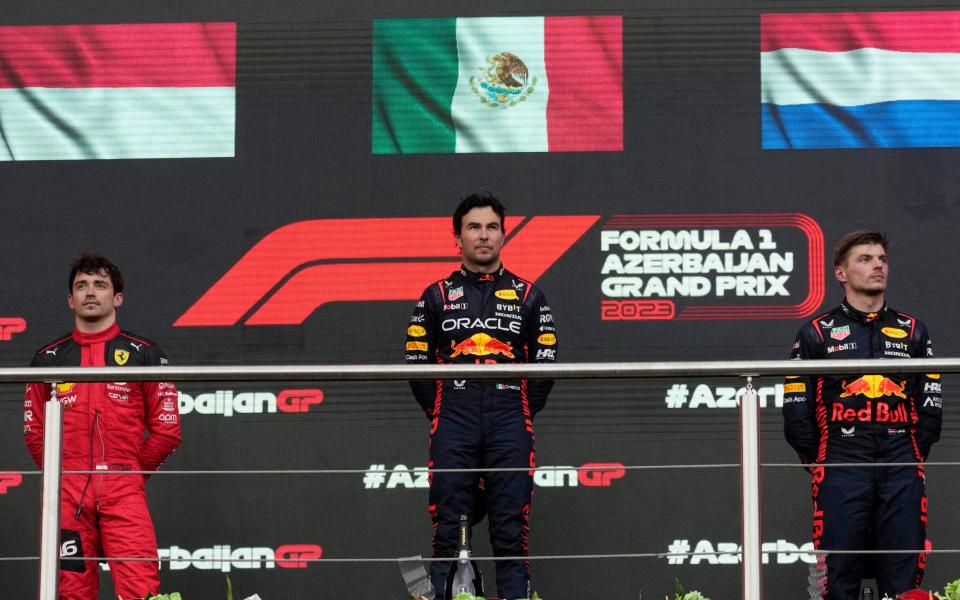 Second placed Red Bull driver Max Verstappen, right, of the Netherlands, third placed Ferrari driver Charles Leclerc of Monaco, left, and winner Red Bull driver Sergio Perez of Mexico attend the awarding ceremony after the Formula One Grand Prix at the Baku circuit, in Baku, Azerbaijan, Sunday, April 30, 2023 - Darko Bandic/AP