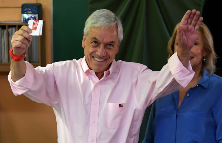 Sebastian Pinera, seen here preparing to cast his vote with his wife, was previously Chile's president between 2010 and 2014