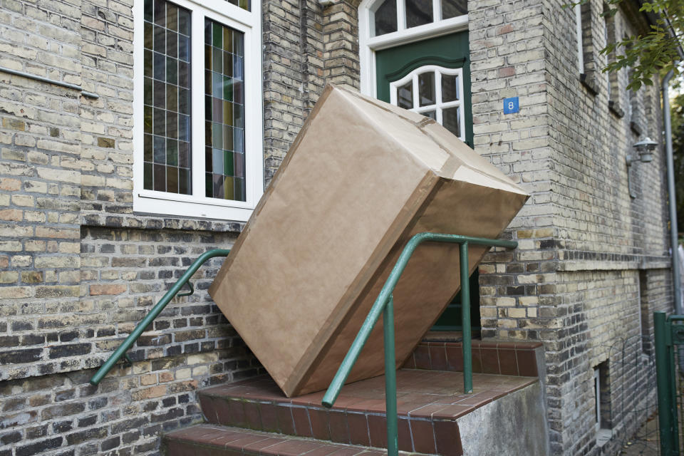 A large box at the top of some stairs