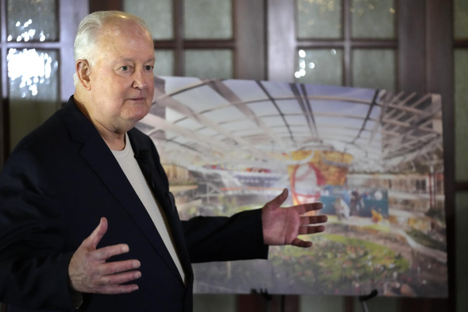 Former Orlando Magic basketball executive Pat Williams unveils renderings, at a news conference, of a proposed domed stadium that he hopes will bring an MLB baseball team to Central Florida, Tuesday, May 9, 2023, in Orlando, Fla. (AP Photo/John Raoux)