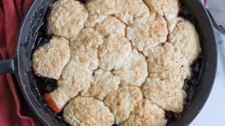 plum cobbler in skillet