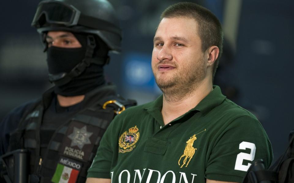 Edgar Valdéz Villarreal, aka 'La Barbie', smirked as he was presented to the media following his arrest in 2010