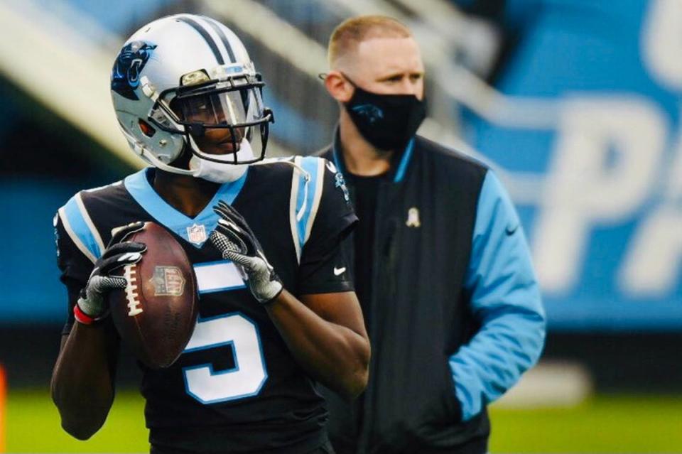 Teddy Bridgewater warms up as offensive coordinator Joe Brady watches in November. Brady was instrumental in bringing Bridgewater to the Panthers, but the QB lasted only one year before being traded.