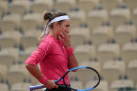 Victoria Azarenka of Belarus reacts after missing a shot against Slovakia's Anna Karolina Schmiedlova in the second round match of the French Open tennis tournament at the Roland Garros stadium in Paris, France, Wednesday, Sept. 30, 2020. (AP Photo/Michel Euler)