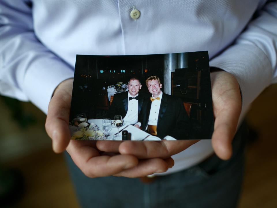 Jim Obergefell holds a photo of him and his late husband John Arthur