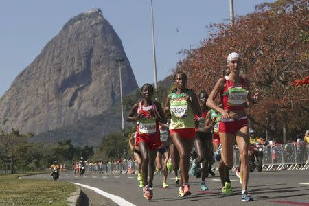 2016 Rio Olympics - Athletics - Final - Women's Marathon - Sambodromo - Rio de Janeiro, Brazil - 14/08/2016. Rose Chelimo (BRN) of Bahrain, Tirfi Tsegaye (ETH) of Ethiopia and Volha Mazuronak (BLR) of Belarus compete. REUTERS/Sergio Moraes