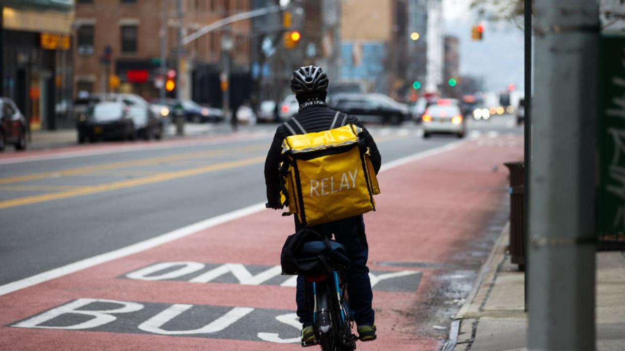 <div>NEW YORK, NY - DECEMBER 29: A food delivery guy with bicycle is seen at the Times Square in New York City, United States on December 29, 2021. (Photo by Tayfun Coskun/Anadolu Agency via Getty Images)</div>