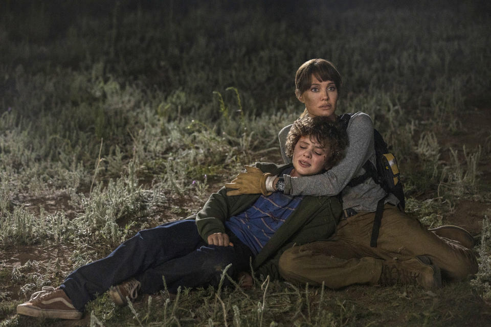 This image released by Warner Bros. Entertainment shows Angelina Jolie and Finn Little in a scene from "Those Who Wish Me Dead." (Emerson Miller/Warner Bros. Entertainment via AP)