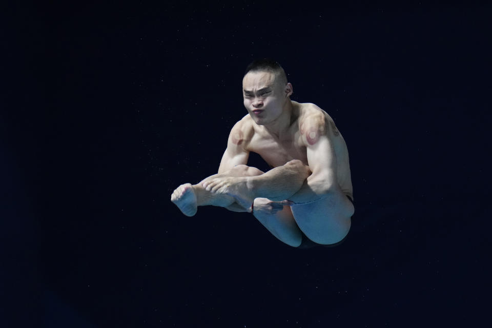 Shixin Li of Australia makes a dive during the men's 1m springboard finals at the World Aquatics Championships in Doha, Qatar, Saturday, Feb. 3, 2024. (AP Photo/Hassan Ammar)